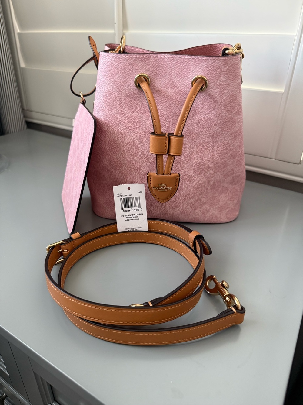 NWOT Coach Outlet Rowan bucket bag in powder pink WITHOUT tea rose charm